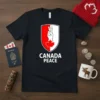 Black t-shirt with "CANADA PEACE" text and a shield graphic featuring a hand with a peace sign and a maple