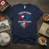 Navy t-shirt with "CANADIAN GROWN WITH FRENCH ROOTS" text and a heart graphic blending a maple leaf and fleur de