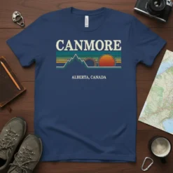 Canmore Alberta Canada retro design with mountains and sunset on a navy blue t-shirt