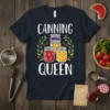 Canning Queen t-shirt design featuring white distressed text and illustrations of jam jars surrounded by greenery