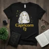 Capricorn Zodiac Shirt with gold glitter text and astrological symbol, featuring a woman's head with braided hair and gold accents