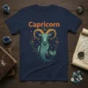 Capricorn zodiac symbol t-shirt featuring a stylized sea-goat illustration with prominent horns and a fish tail, surrounded by stars and