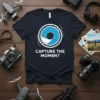 Navy t-shirt with "CAPTURE THE MOMENT" text and a camera aperture graphic, ideal for photographers