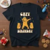 Capy Birthday t-shirt with a dabbing capybara and two smaller capybaras, surrounded by confetti. Features "CAPY BIRTHDAY" text