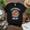 Capybaras Relax t-shirt design with two capybaras in a floral wreath, white text on black tee