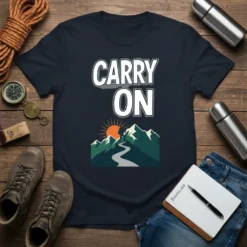 Carry On text above a mountain landscape graphic with a winding path and sun on a navy t-shirt