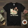 Black t-shirt featuring the "Cat Blooms" text with a stylized cat adorned with pink flowers and green leaves