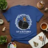Blue t-shirt with a black cat and orange butterfly design, featuring text "CAT & BUTTERFLY A GENTLE FRIENDSHIP"