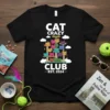 Black t-shirt with "CAT CRAZY CLUB EST 2024" text and a colorful graphic of cats on a cat tree