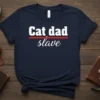 Cat Dad Slave humorous quote t-shirt in navy blue with white and red text