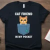 Cat Friend In My Pocket T-Shirt with cute orange tabby cat peeking from a blue pocket with a ball of
