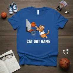 Cat Got Game t-shirt design with a tabby cat dunking a basketball on a royal blue tee