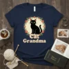 Cat Grandma t-shirt design featuring a black cat in a floral wreath with text "Cat Grandma"