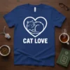 White CAT LOVE text and a sleeping cat silhouette inside a heart on a navy blue t-shirt