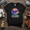 Black t-shirt with "CAT LOVER PURRFECTION" text and a geometric cat design inside a sunset circle