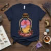 Cat Lungs T-Shirt design featuring multiple colorful cats huddled together inside a glass bottle, with the text "CAT LUNGS" on