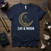 Navy t-shirt with gold CAT & MOON text and a stylized cat sitting on a crescent moon graphic