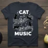 Cat Music t-shirt design featuring black cats dancing on musical notes and the words CAT MUSIC in bold white letters