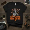 Black t-shirt with "Cat Playing Rock Guitar" text and a cartoon cat playing a guitar