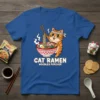 Cat Ramen Noodles Forever text on a blue t-shirt with a cartoon cat eating ramen