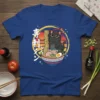 Black cat eating ramen with Japanese text "寿" on a blue t-shirt, set against a sunset graphic