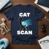 Black cat with X-ray skeleton graphic and "CAT SCAN" text on a navy t-shirt