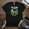 Cat Scan t-shirt with a glowing skeleton cat graphic and neon green circle, white text