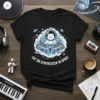 Black t-shirt featuring the text "CAT ON SYNTHESIZER IN SPACE" with a cartoon cat wearing a space helmet playing a