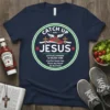 Navy t-shirt with "Catch Up With Jesus" text, a winged running shoe, and tomato graphics. Features punny phrase about lettuce