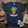Navy blue t-shirt featuring a kawaii green cactus with cat ears and paws, labeled "Catcus" in white lettering
