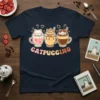 Catpuccino t-shirt design featuring three cute cats in coffee cups with hearts and playful text