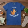 Cats Not Drugs! text with an orange tabby cat wearing a wreath holding yarn on a blue t-shirt