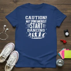 Blue t-shirt with white text "CAUTION! MAY SPONTANEOUSLY START DANCING" and dancing silhouettes graphic