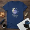 Celestial Cat Café text design with a cute cat sleeping in a starry teacup, on a navy t-shirt