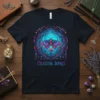 Celestial Wings t-shirt design featuring a vibrant moth inside an enchanted forest with glowing blue and purple hues