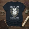 Celtic Cat Guardian Of The Ancient Knots T-Shirt featuring a white cat with green eyes inside a Celtic knot shield