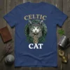 Celtic Cat T-Shirt with a grey cat and green eyes surrounded by intricate green knotwork design