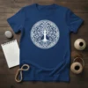 White Celtic Tree of Life design on a navy blue t-shirt, showcasing intricate knotwork and symbolism