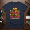 Navy blue t-shirt with bold yellow and red text that reads "C'EST QUI LE PATRON? C'EST MOI LE PATRON" and