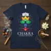 Chakra Energy Healing T-Shirt featuring a meditating figure with colorful chakras and a lotus flower, yoga apparel
