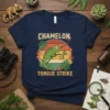 Chamelon Tongue Strike t-shirt design featuring a green chameleon catching a dragonfly with its tongue, surrounded by tropical leaves and