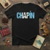 Black t-shirt with "CHAPÍN" text overlaying the Guatemalan flag design, distressed texture