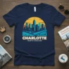 Charlotte North Carolina skyline graphic t-shirt with text CHARLOTTE NORTH CAROLINA and a sunset design
