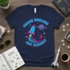 Navy blue t-shirt with "CHASE DREAMS NOT CLOUDS?" text and a colorful rocket ship illustration with a planet and stars