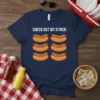 Navy t-shirt with white text "CHECK OUT MY 6 PACK" above six cartoon hot dogs in buns with mustard