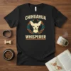 Black t-shirt with "Chihuahua Whisperer" text and a graphic of a Chihuahua's head inside a laurel wreath