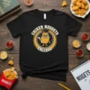 Black t-shirt featuring a cartoon chicken nugget wearing a graduation cap and holding a diploma, with text "CHIKEN NUGGETS COLLEGE"