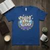 Child Of God t-shirt with retro-style lettering, sun, waves, and doves in a circular laurel wreath design