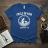 Blue t-shirt with "CHILD OF GOD Ephesians 1:5" text and a circular graphic of a shepherd with a lamb