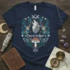 Child of the Night t-shirt design featuring a howling wolf, deer, butterflies, mushrooms, and moon phases in a circular wreath